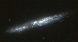 NGC 55 - спиральная галактика с баром. Описание NGC 55:, Галактика в созвездии Скульптор